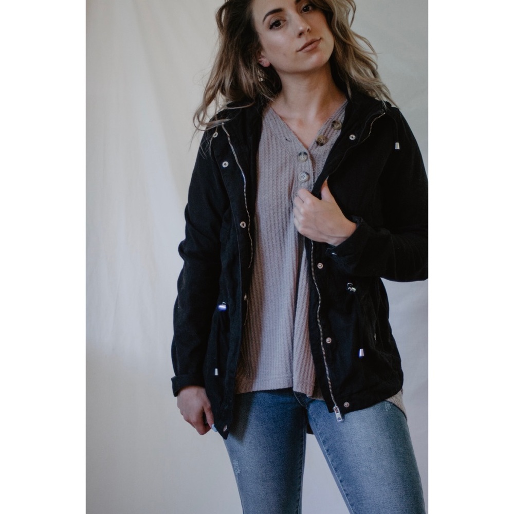 Black jacket with hood and zipper front